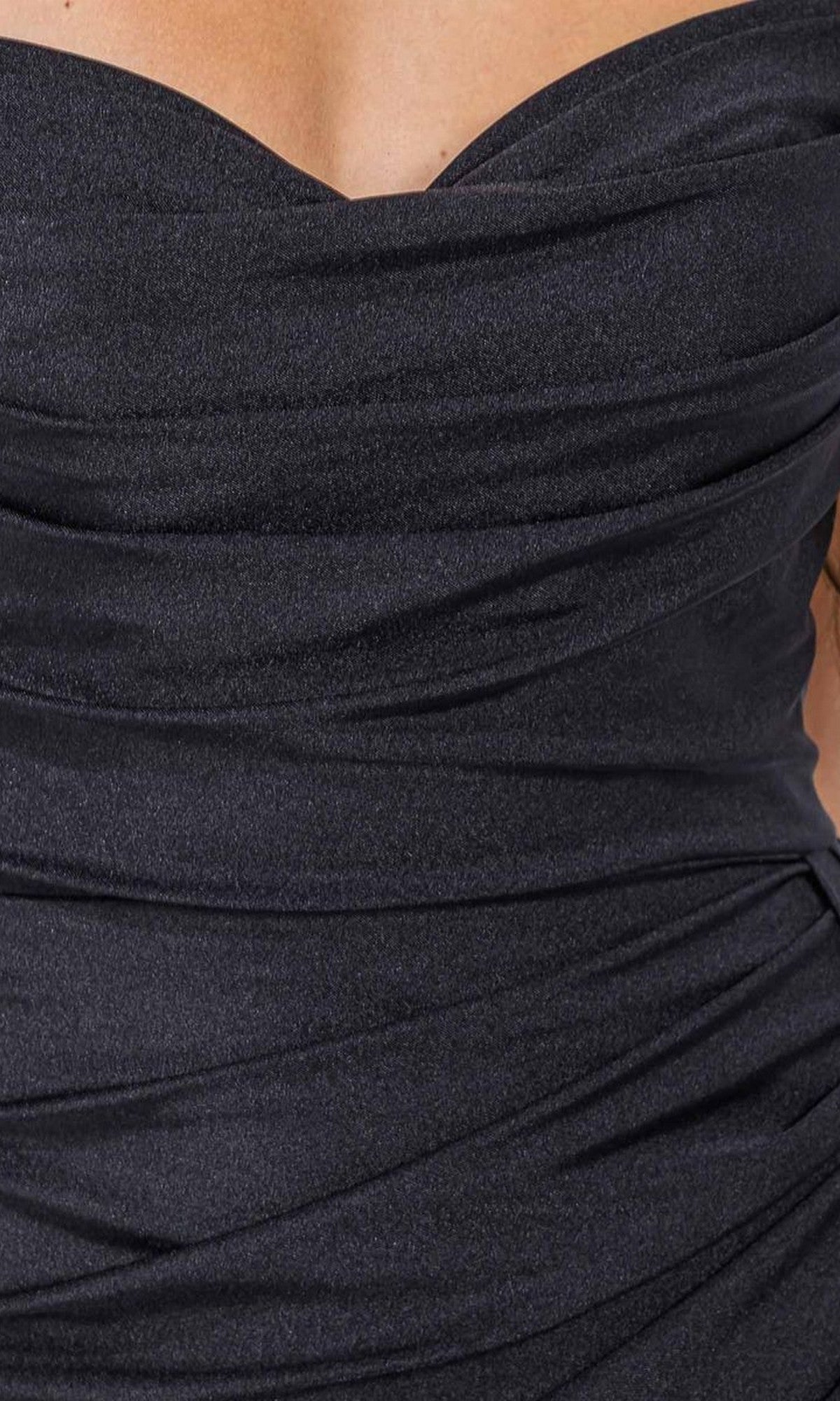 Close-up of a person wearing the Eureka EK178 Long Prom Dress, featuring black silky jersey fabric with ruching and a flattering strapless sweetheart neckline.